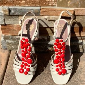 Vince Camuto leather sandals with embellishments.